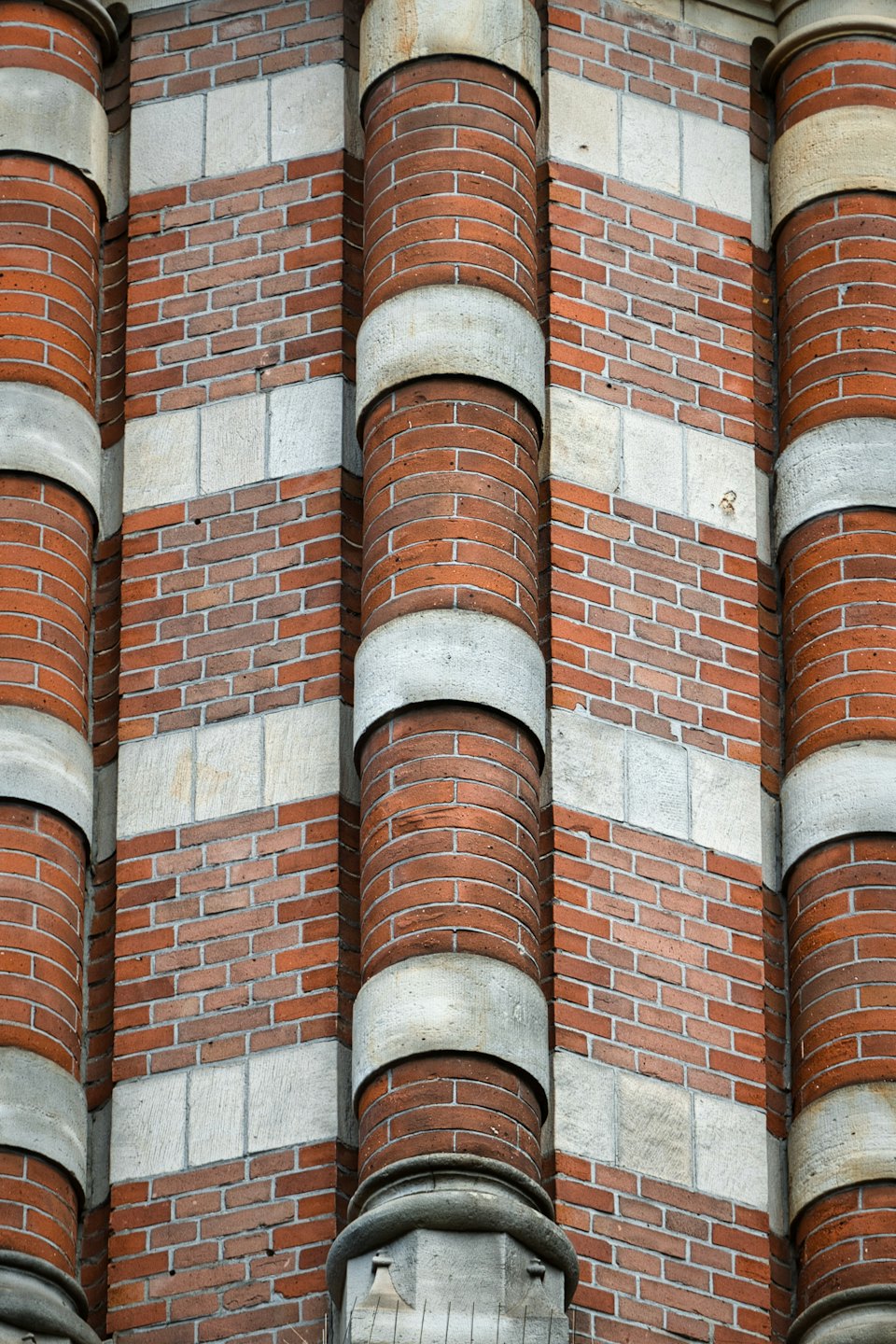 Red bricks and grey stone decorate the building facade.